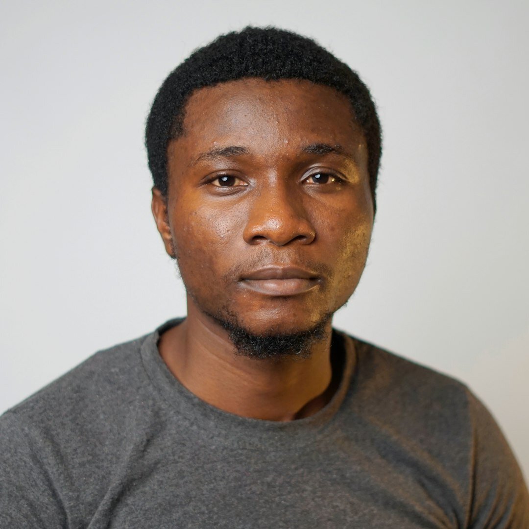Belgian man of Congolese descent crisis coverage trainer studio portrait