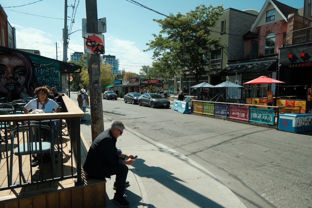 Camera crew filming a live report outdoors on a city street