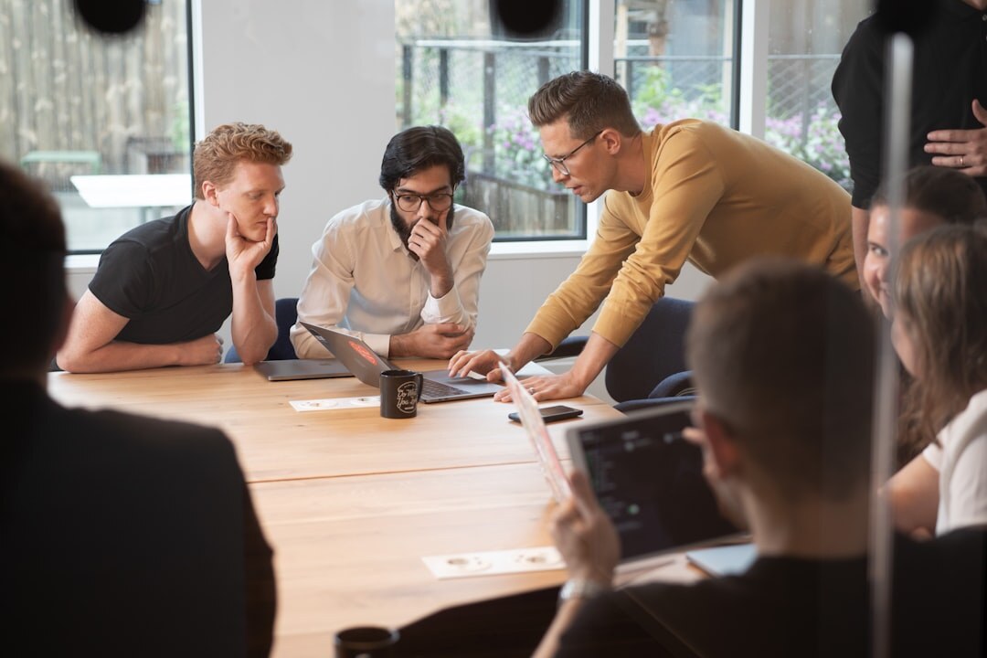 Editorial team meeting around a table planning coverage